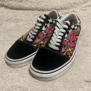 Vans Cheetah print and checkerboard pattern with roses. Has a clear jazz stripe.